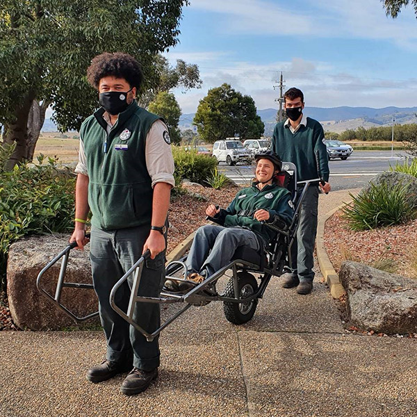 Parks and Conservation Service staff demonstrating use of the TrailRider all-terrain wheelchair.