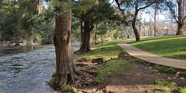 A section of the river, walking path and recreational area at Cotter Avenue.